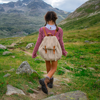 Little girl during a summer camp for kids in the mountains