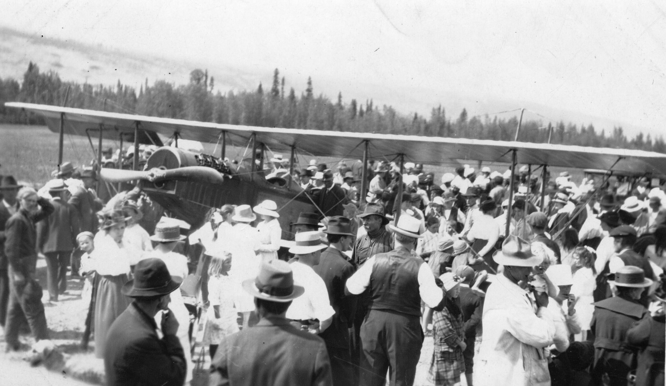 Crowd of onlookers at the landing of the first airplane in Golden, BC